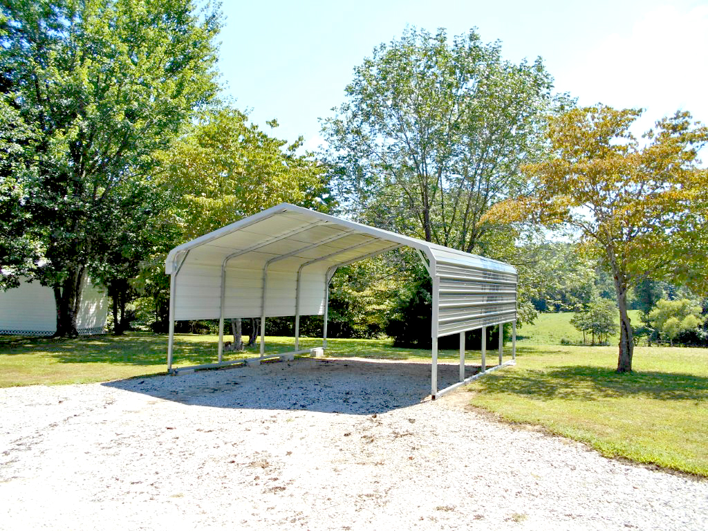 Metal carport installed on a gravel pad